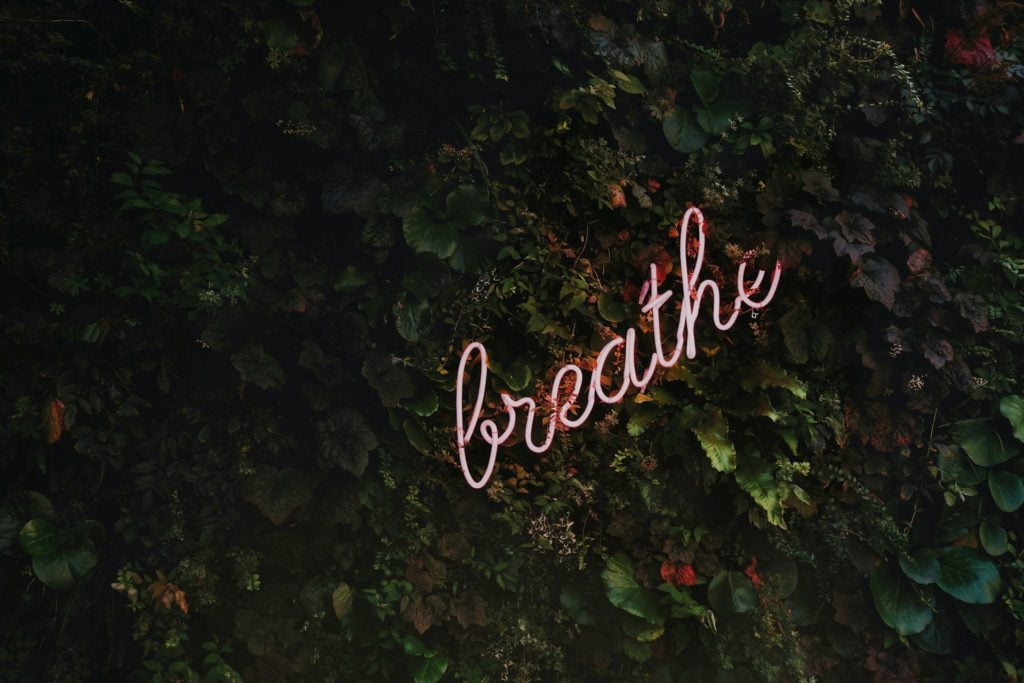neon word breathe